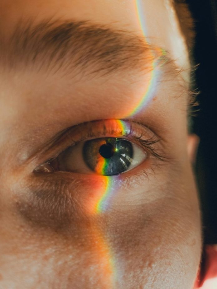 Close up of mans face with light falling on it