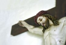 Close up of a jesus on the cross figurine