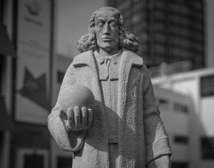 Monochrome stone statue in urban setting