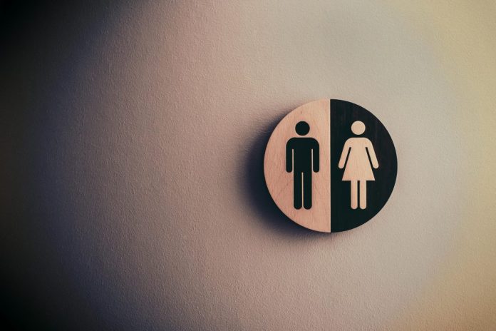 Male and female signage on wall