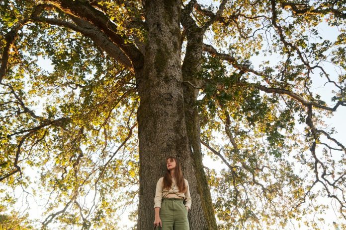 Woman under tree