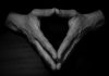 Clasped hands of man