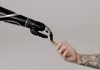 A person holding a prosthetic arm