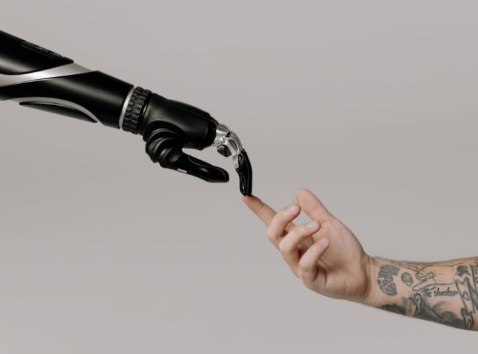 A person holding a prosthetic arm